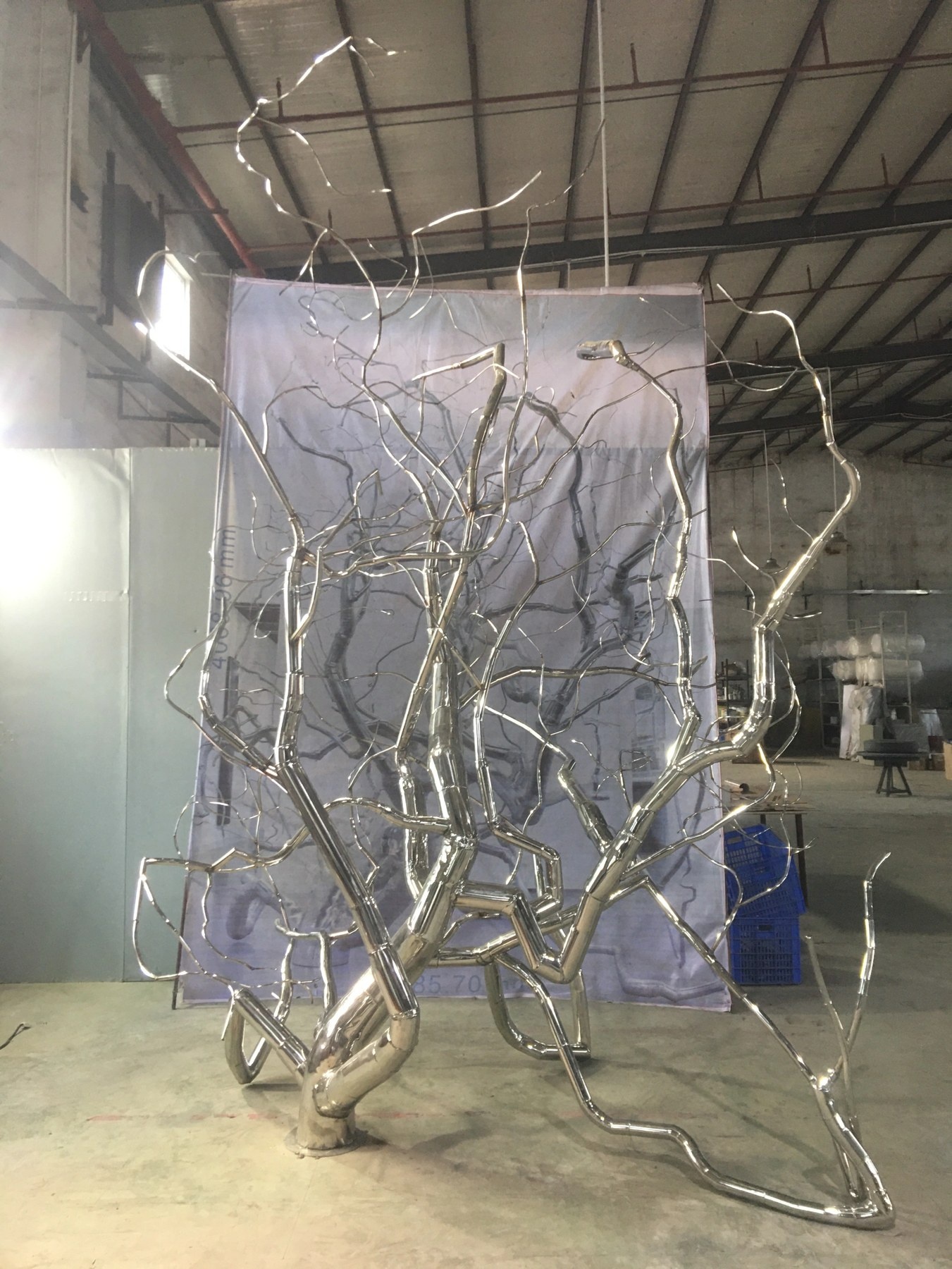 Front workshop view of the same organic branch sculpture assembly