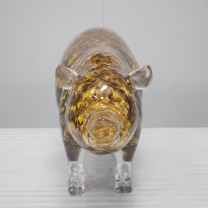 Transparent golden openwork pig display sculpture front three-quarter view