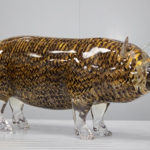 Side view of the same transparent openwork pig display sculpture