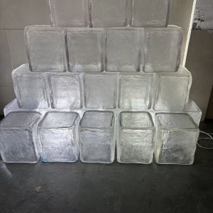 Completed set of custom transparent resin ice cube display props in the workshop