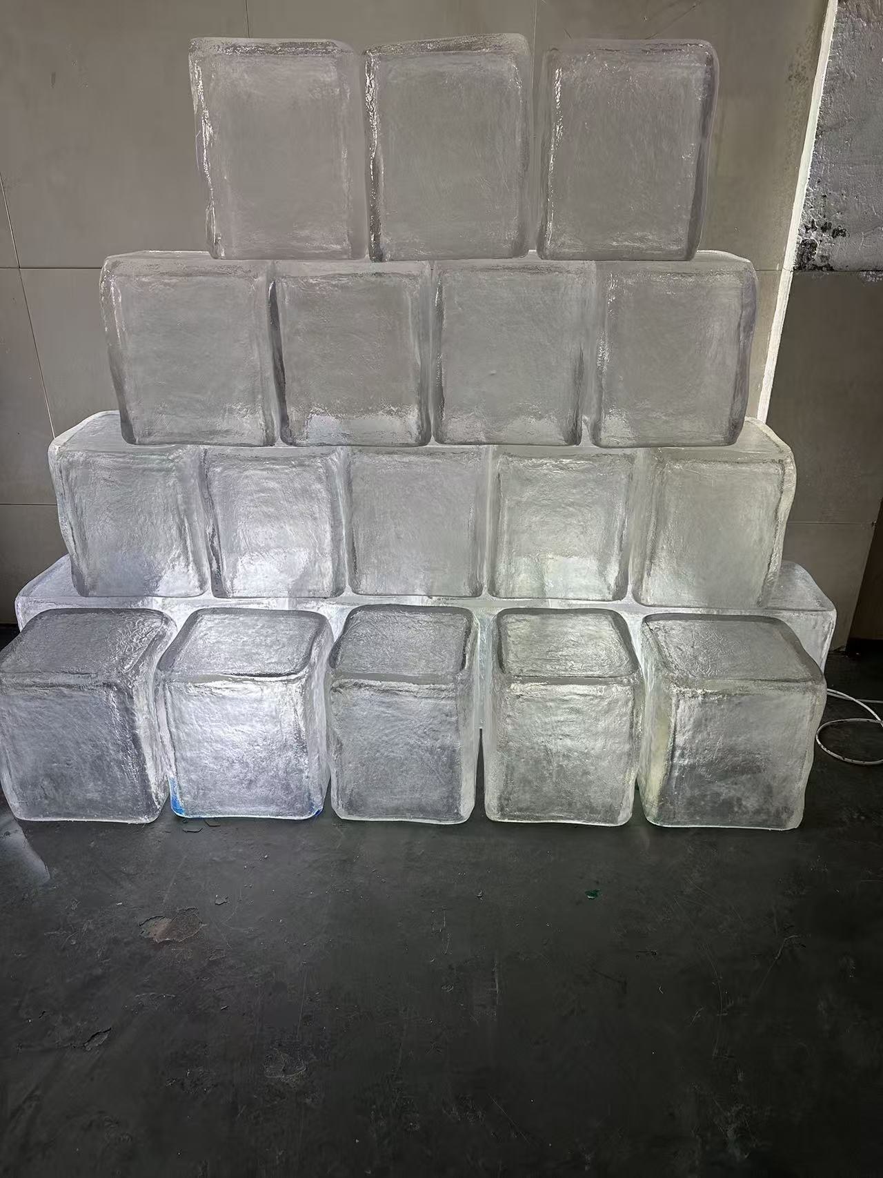 Completed set of custom transparent resin ice cube display props in the workshop