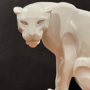 Rear three-quarter view of the same white panther sculpture